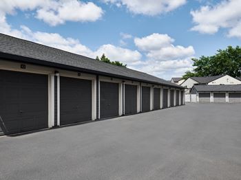 A long row of garage doors are closed.